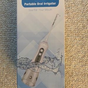 Potable oral irrigator
